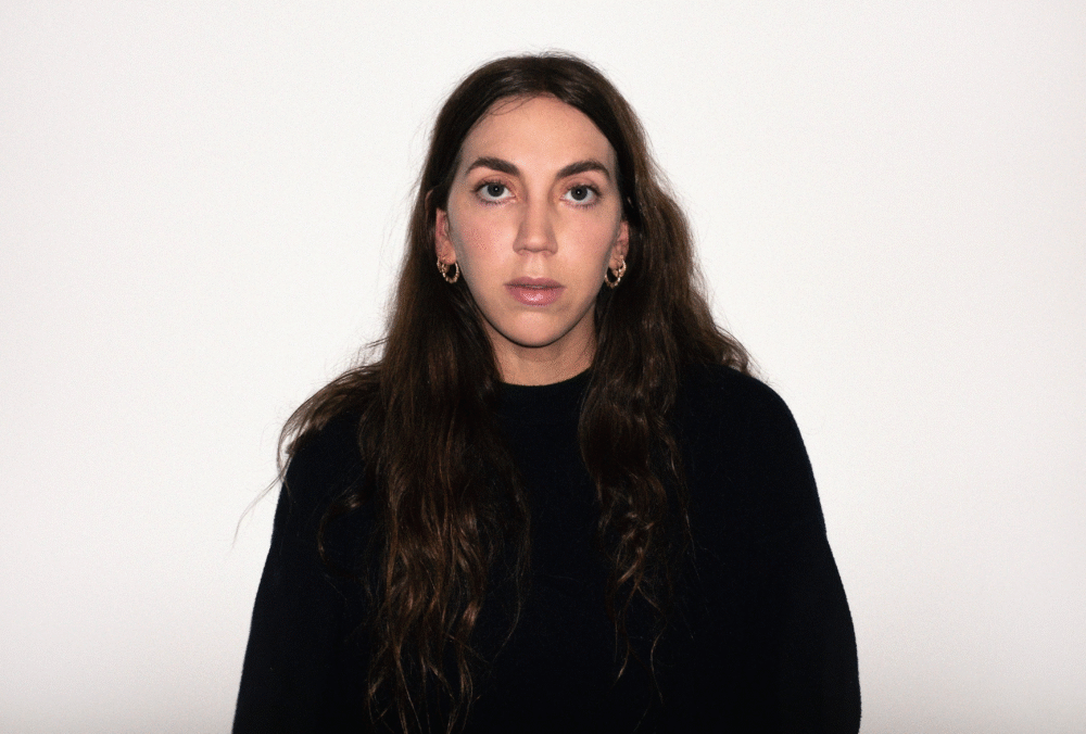 Gina Gammell portrait, head and shoulders shot against a white background.