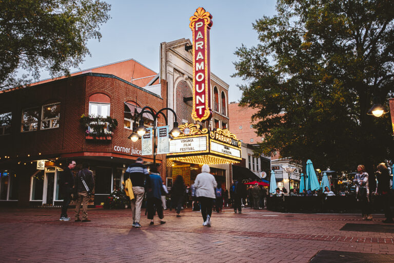 Paramount Theater hosts the Virginia Film Festival. Brick pedestrian area, evening scene. "Virginia Film Festival" text visible.