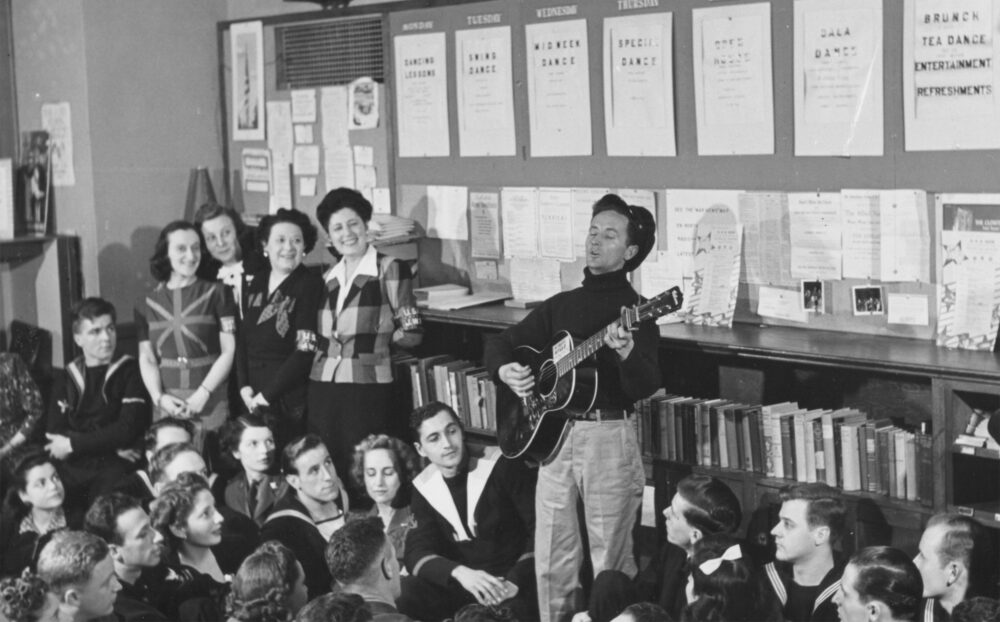 USO Club Jewish Welfare Board event with Woody Guthrie singing