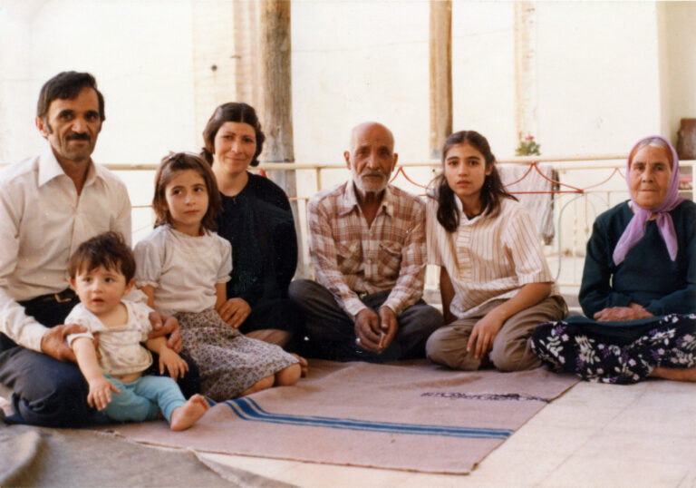 Multi-generational family posing for a photo, possibly related to 