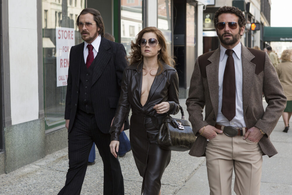 Christian Bale, Amy Adams, and Bradley Cooper in American Hustle