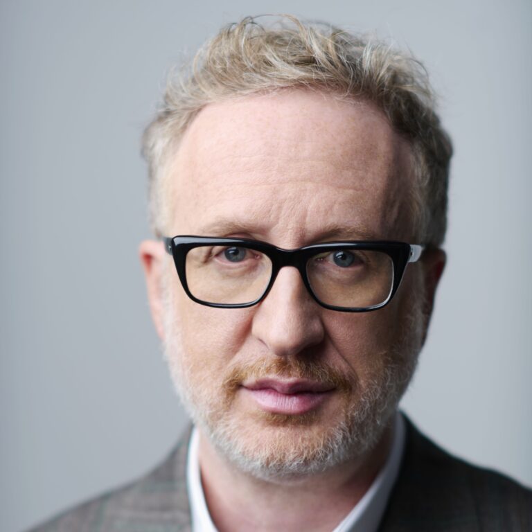 James Gray, director, wearing glasses and a suit jacket