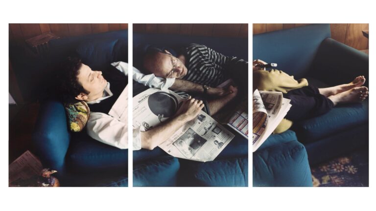 Maurice & Marvin: Two men resting on a blue sofa, reading newspapers.