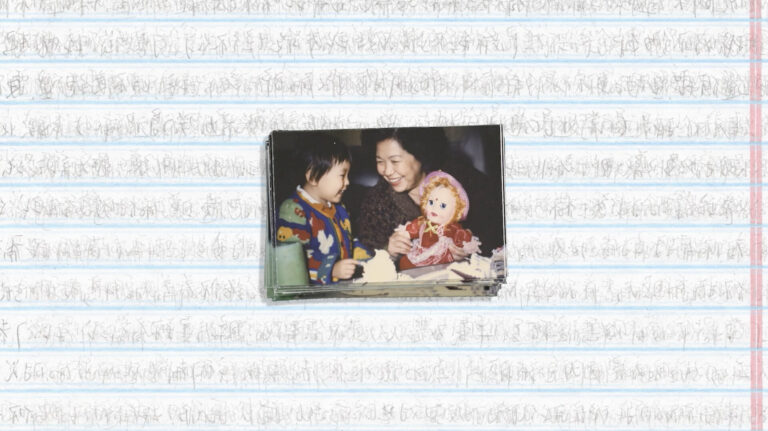A mother smiles at her child holding a doll, a tender moment captured in a family photo.