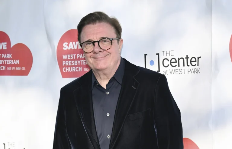 Nathan Lane smiles in a black jacket at an event with "The Center at West Park" logo.