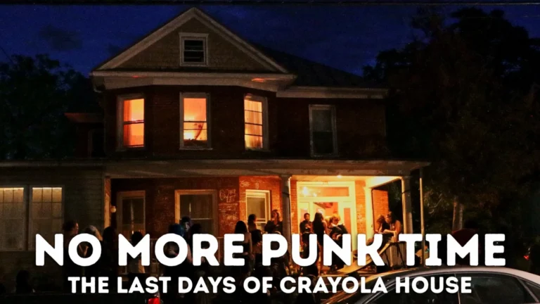 NO MORE PUNK TIME: The Last Days of Crayola House, a brick home at dusk with people gathered on the porch.
