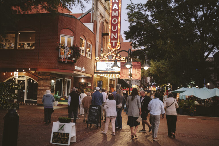 Virginia Film Festival attendees walk past the Paramount Theater.